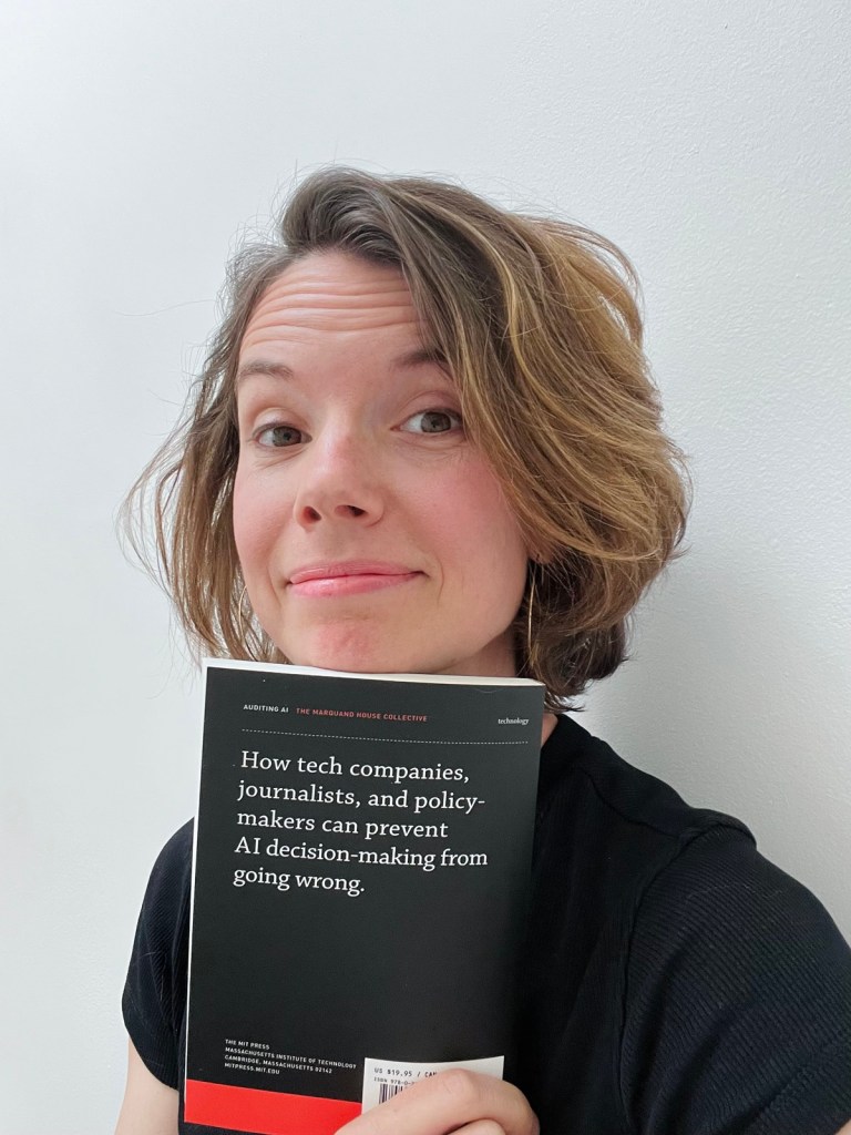 Ellery with a copy of Auditing AI